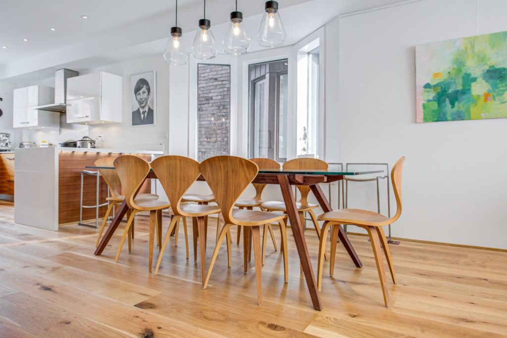 Fuzion's Oak Concerto hardwood flooring in the dining area of a stylish artistic loft.